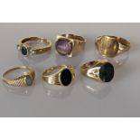 An assortment of five lady size rings set in 9ct yellow gold