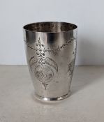 A continental silver beaker with fruit and foliate etched decoration, 10 cm H, 137g