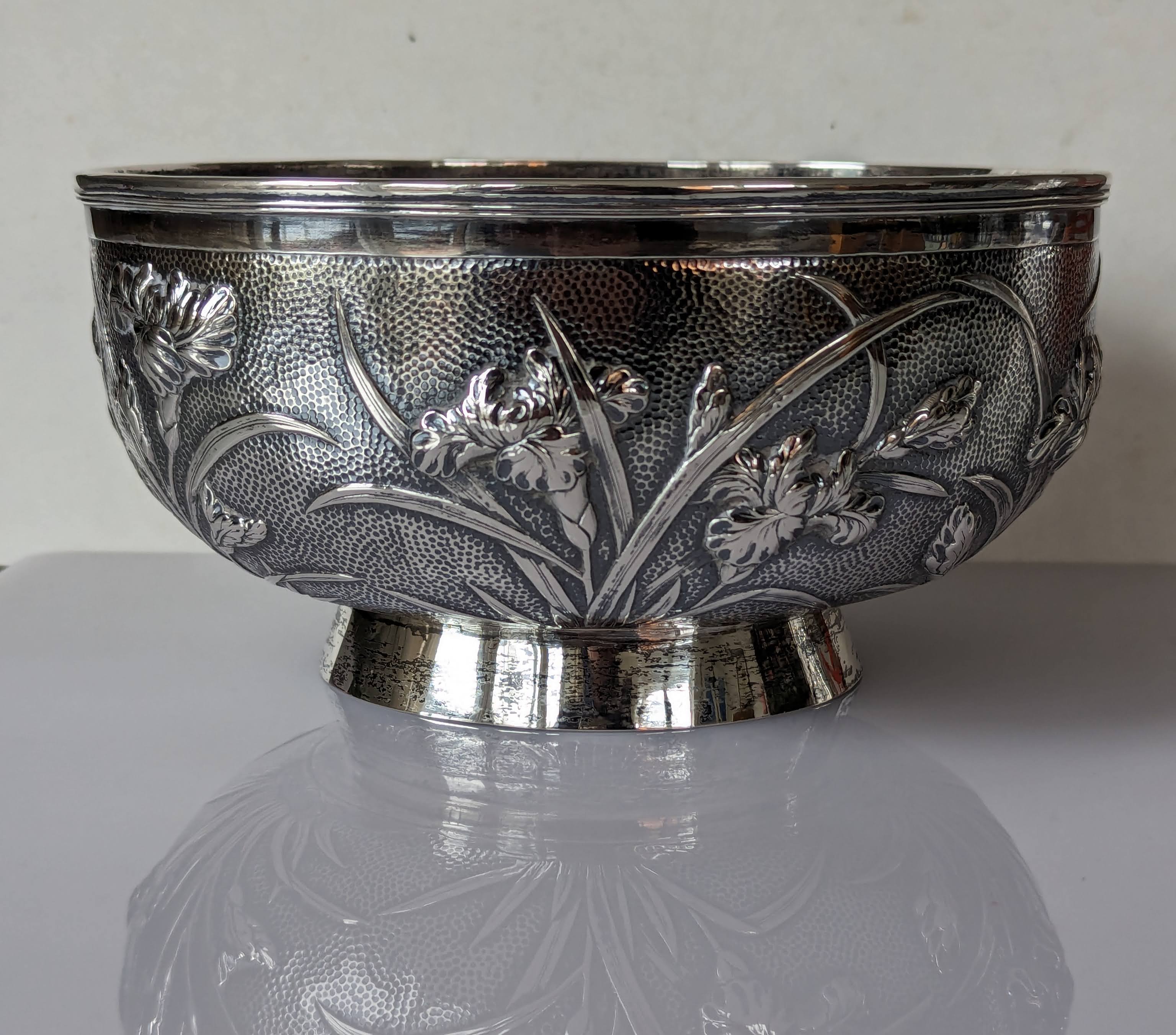 A Chinese silver circular bowl with banded rim, embossed flowers on a planished ground - Image 3 of 4