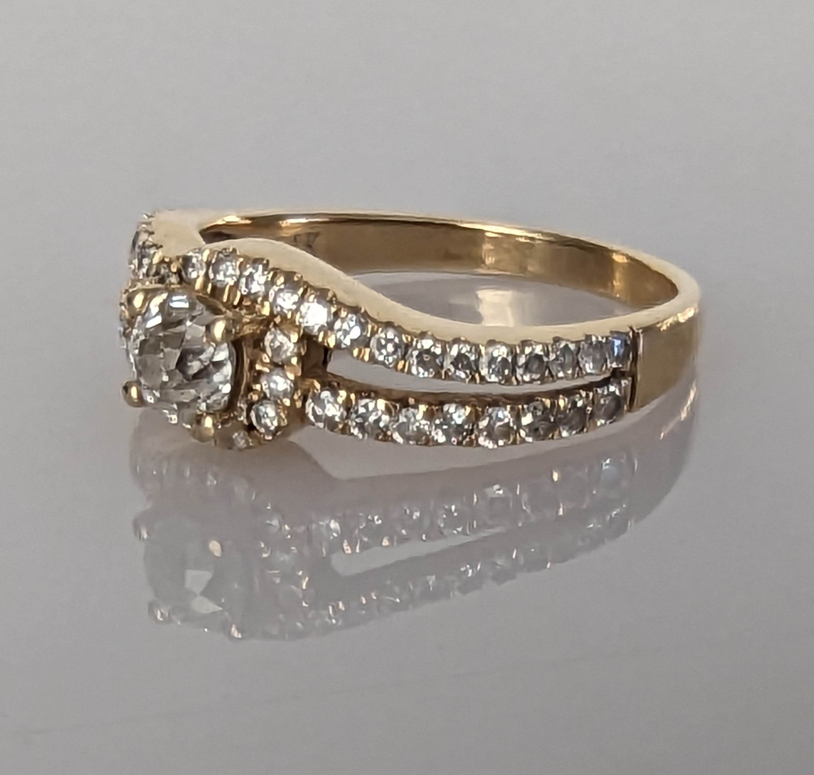 A solitaire diamond ring with split shoulder shank, decorated with diamonds to both sides - Image 2 of 8