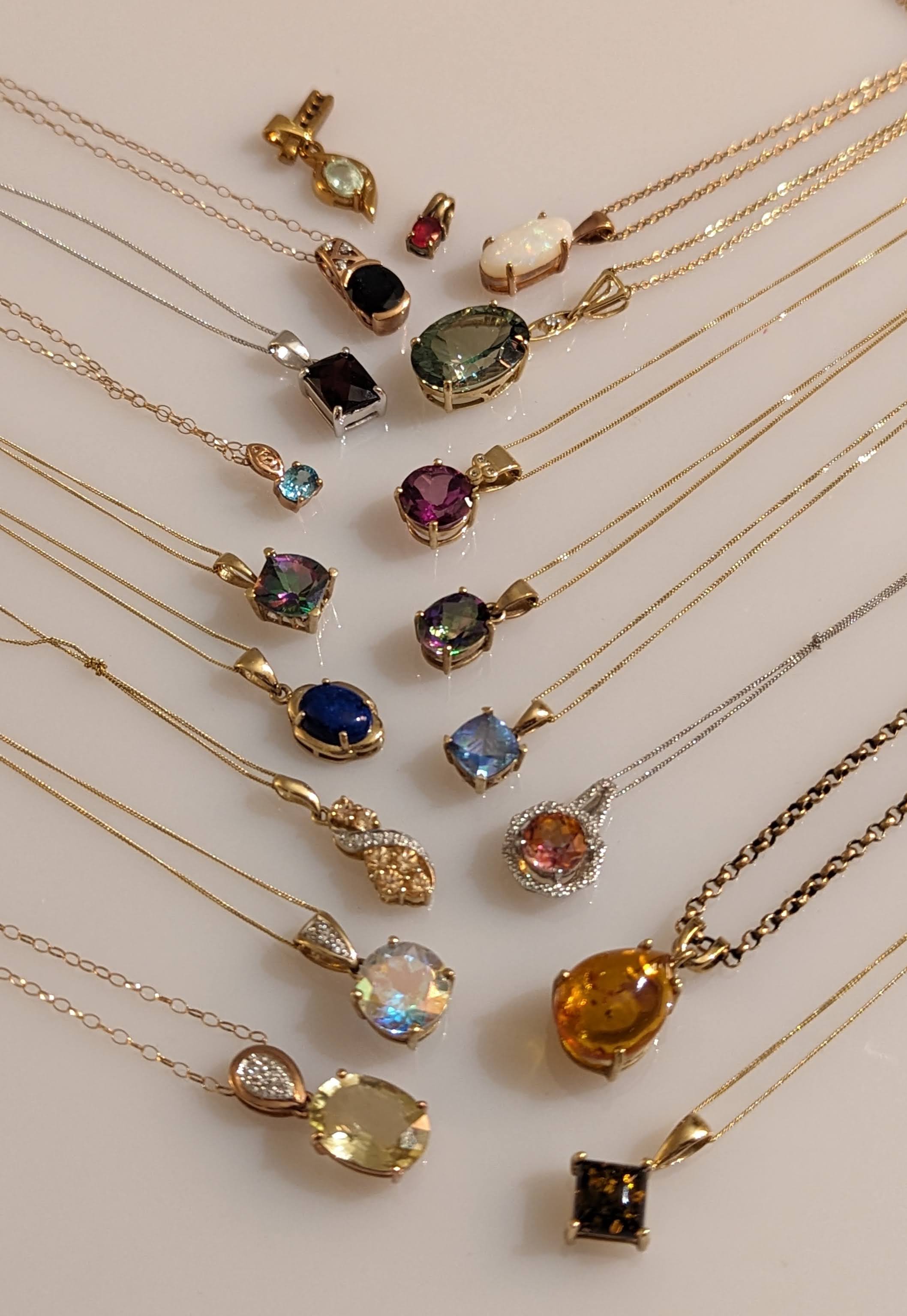 An assortment of sixteen gem-set pendant neck chains in 9ct yellow, rose and white gold, - Image 3 of 3