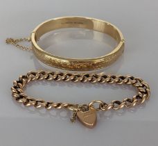 A 9ct rose gold curb-link bracelet with heart locket, 16 cm, 12.3g