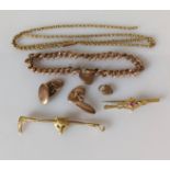 An assortment of 9ct gold jewellery to imclude a rose gold curb-link bracelet with heart locket