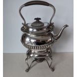 An Edwardian silver tea kettle on stand with fluted decoration, wood handle and knop