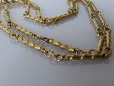 An 18ct yellow gold watch chain with bamboo effect baton links, hallmarked