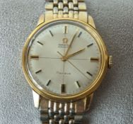 An Omega Automatic Geneve wristwatch with baton markers on a champagne dial