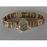 An Omega ladies Geneve manual dress watch with baton markers, champagne dial, 18mm