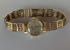 An Omega ladies Geneve manual dress watch with baton markers, champagne dial, 18mm