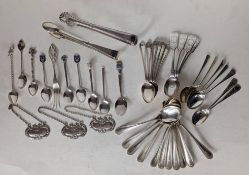 Three silver bottle labels, a miscellany of tea, coffee and souvenir silver spoons 