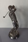 A silver statuette of a golfer, hallmarked, maker's mark HL, Sheffield, 21.5 cm H, weighted