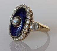 A 19th century diamond and enamel oval ring on a yellow gold setting