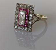 An Art Deco diamond and ruby platform ring on an 18ct yellow gold setting
