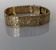 A 1920s Viennese yellow gold bracelet with etched decoration, hallmarked for 15ct gold, 14.6g