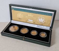 A cased Royal Mint 2002 Queen Elizabeth II Golden Jubilee gold proof sovereign Four Coin Collection