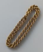 A 9ct yellow gold rope-twist necklace, 62 cm, 8mm wide, clasp good, hallmarked, 38g