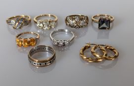 A selection of seven gem-set 9ct yellow and white gold rings, mixed sizes, and a pair of 9ct gold