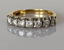 A half-hoop diamond eternity ring on a yellow gold setting