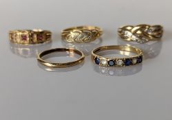 An assortment of two 9ct gold gem-set rings, one wedding band, all hallmarked, 5.75g