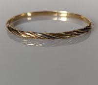 A yellow gold hinged bangle with rope twist design, 60mm, stamped 585, 14.12g
