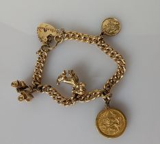 A 9ct yellow gold charm bracelet, each link stamped with a mounted half sovereign attached, 1911