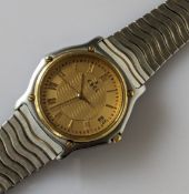 An Ebel Classic Sports Wave wristwatch with gold face, Roman numerals, date aperture