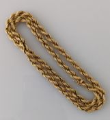 A 9ct yellow gold rope-twist necklace, 62 cm, 8mm wide, clasp good, hallmarked, 38g