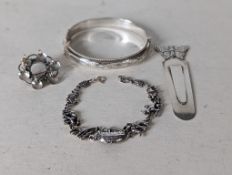 A silver bangle with etched decoration, 55mm; a Noah's Ark silver bracelet, 17 cm