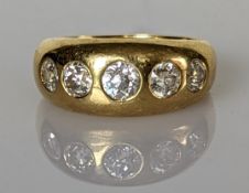 An 18ct yellow gold gypsy ring with five graduated old-cut diamonds on a tapered shank