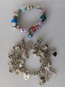 A silver Trollbeads bracelet with twelve charms and six spacers, all stamped LAA, 19.5 cm