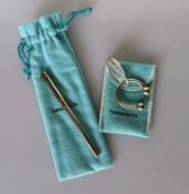 A Tiffany & Co.925 silver key ring, 3cm wide with  pouch and a Tiffany & Co. silver ballpoint pen