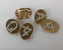 A pair of yellow gold cufflinks with diamond initials and a matching signet ring with same initials