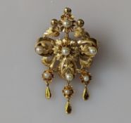A yellow gold brooch with pearl and carved foliate decoration, unmarked, test for 18ct gold