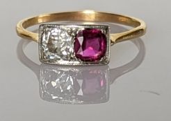 An Art Deco ruby and diamond platform ring, the cushion-cut 0.65 carats diamond 