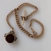 A 9ct rose gold Albert graduated chain with T-bar, lobster clasp and swivel fob, each link stamped