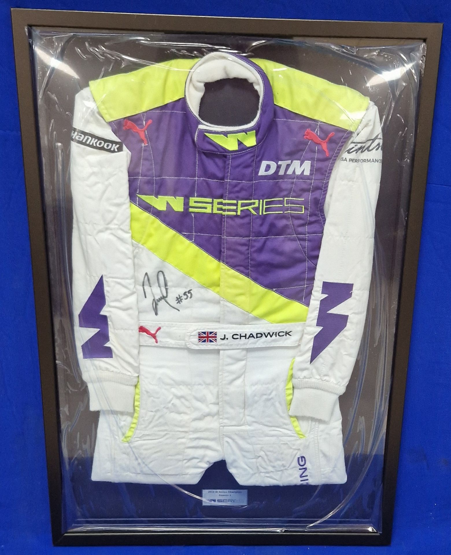 A Framed & Glazed (Perspex) W Series Race Suit Signed by Jamie Chadwick Commemorating Her 2019 Serie