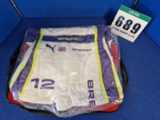 One Unworn PUMA FIA approved Suit (Size - Made to Measure) embroidered with the name L. Brewer in a