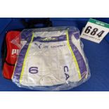 One Unworn PUMA FIA approved Suit (Size - Made to Measure) embroidered with the name M. Caceres in a