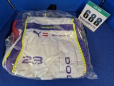 One Unworn PUMA FIA approved Suit (Size - Made to Measure) embroidered with the name J. Dolischka in