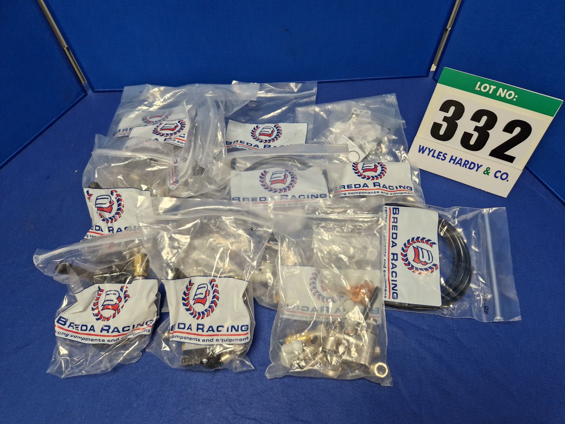 A Quantity of BREDA RACING Air Jacks Spare Parts including:- Three Rise/Drop Levers, Two Rise/Drop
