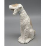 Porzellanfigur, Sitzender Hund, Spanien, Nao, Weißporzellan mit farbiger Staffierung, gem., 16 x 9 