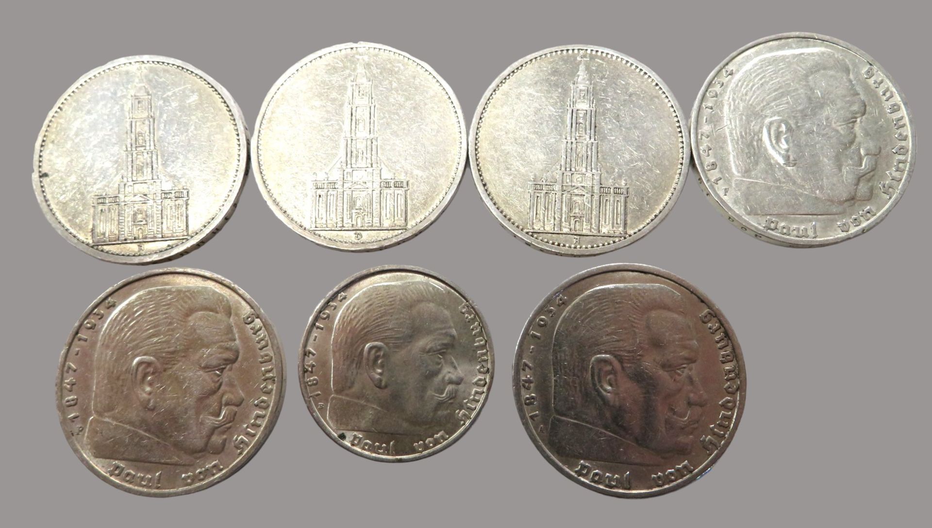 Konvolut von 7 diversen Münzen, 3. Reich, 3 x 5-Mark, Garnisonskirche, 1 x 1934, 2 x 1935/2 x 5-Mar