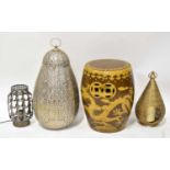 Three pierced metal lanterns of various designs, together with a Chinese ceramic garden seat,