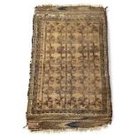 An antique Belouch beige ground rug, with geometric designs, 128 x 79cm.