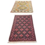 A modern hand woven red and blue ground geometric design carpet, 150 x 85cm, and a further machine