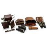 Three cased pairs of binoculars comprising Binolux Triple Tested 7x30, two further pairs of early