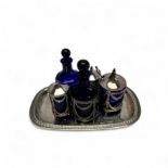 A seven-piece silver oil and vinegar set on tray