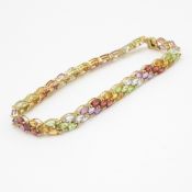 9ct gold garnet, citrine, amethyst, peridot, and topaz set tennis bracelet (9.3g)