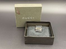 GUCCI, &nbsp;a black, grained, leather wallet with signed and polished clasp