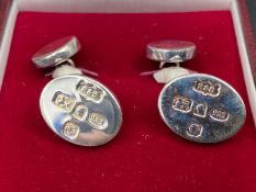 Roberts & Doré, a cased pair of hallmarked silver cuff links,