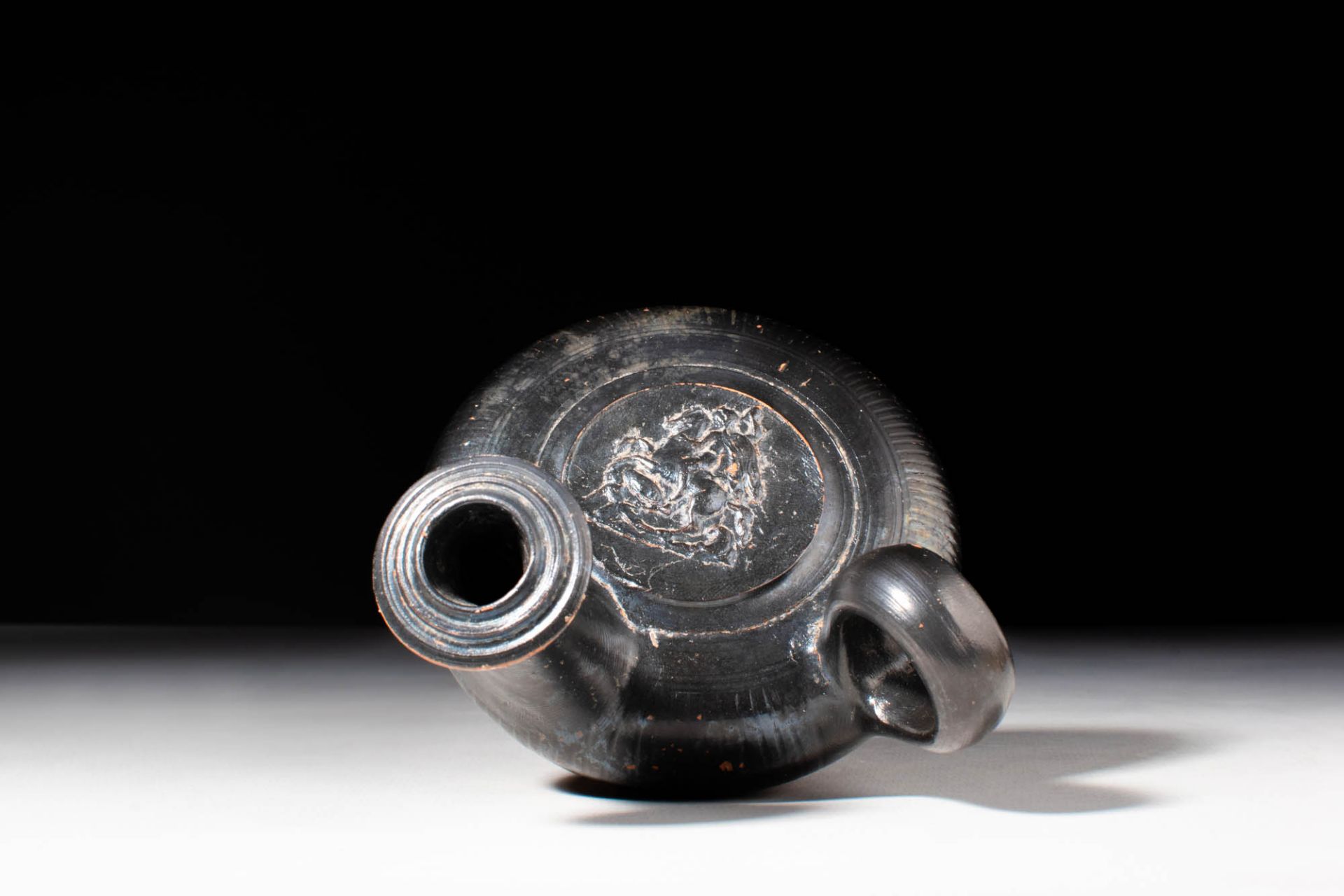 GREEK BLACK-GLAZED GUTTUS WITH RIDER AND HORSE